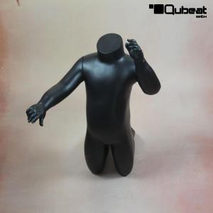 Black kneeling child window mannequin