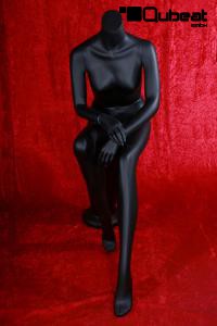 Weibliche Schaufensterpuppe Schaufensterfigur schwarz sitzend kopflos Mannequin